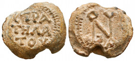Byzantine lead seal of Ioannes stratelates
(6th cent.). 
Obv.: N-monogram, ΙΩΑΝΝΟΥ (Of Ioannes), wreath border.

Rev.: Inscription in 3 lines, CΤΡΑ/ΤΗ...