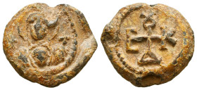 Byzantine lead seal of Evdokios officer
(6th cent.). 

Obv.: Facial bust of the Mother of God, nimbate, wearing maphorion and chiton, holding Jesus Ch...