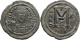 Justinian I, 527-565. Follis (Bronze, 41 mm, 23.35 g, 6 h), Nicomedia, RY 12 = 538/9. D N IVSTINIANVS P P AVI Helmeted and cuirassed bust of Justinian...