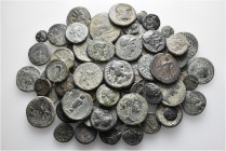 A lot containing 74 bronze coins. Includes: Greek and Roman Provincial. Fine to very fine. LOT SOLD AS IS, NO RETURNS. 74 coins in lot.