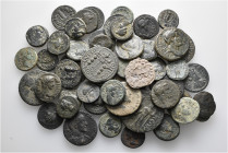A lot containing 53 bronze coins. Includes: Greek and Roman Provincial. Fine to very fine. LOT SOLD AS IS, NO RETURNS. 53 coins in lot.
