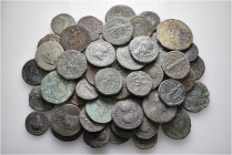 A lot containing 59 bronze coins. All: Roman Provincial. Fine to about very fine. LOT SOLD AS IS, NO RETURNS. 59 coins in lot.