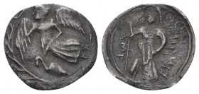 Sicily, Camarina Litra circa 461-435, AR 12.00 mm., 0.46 g.
Nike flying l. before; swan; the whole within wreath. Rev. Athena standing l., holding sp...