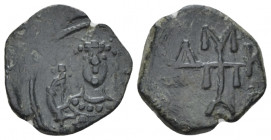 Manuel I Comnenus, 1143-1180 Half tetarteron Uncertain mint 1143-1152, Æ 14.20 mm., 1.23 g.
Crowned facing bust of Michael, holding labarum and globu...