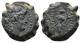 Seleukid Kings, Alexander II Zabinas (128-122 BC). Æ Serrate. Apamea on the Orontes(?) Av.: Head of young Dionysos r., wearing ivy wreath. Rv.: Winged...