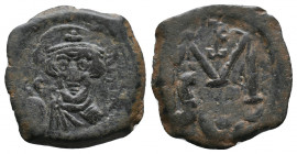 Constans II 641-668 AD, Syracuse Mint, struck 641/647 AD

Obv.: Crowned bust facing, wearing chlamys and holding globus cruciger
Rv.: Large M; mono...