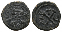 Maurice Tiberius 582-602 AD., AE Decanummium, Antioch mint (Theoupolis), struck 586/587
Obv.: DNTIA NI..., Facing bust, crowned with trefoil ornament...