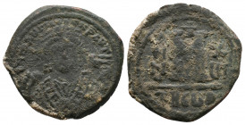 Maurice Tiberius, 582-602. AE Follis Antioch mint, struck AD 597/598 (RY 16)
Obv.: Crowned bust of Maurice facing, wearing consular robes, holding ma...