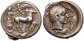 Sicily, Leontinoi. Silver Tetradrachm (17.28 g), after 480 BC. Dies engraved by the "Demareteion Master". Charioteer, holding kentron and reins, drivi...
