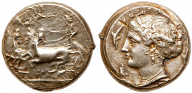 Sicily, Syracuse. Silver Tetradrachm (17.35 g), ca. 405-400 BC. Unsigned dies in the style of Eukleidas. Charioteer driving quadriga left; above, Nike...