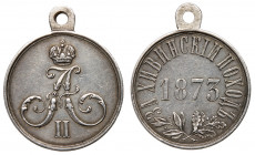 Award Medal for the Khiva Campaign, 1873. Silver. 28 mm. Bit 981 (R1), Diakov 804.1(R2). Crowned cipher of Alexander II /Date, legend around, crossed ...