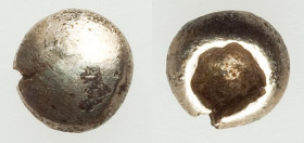 IONIA. Uncertain mint. Ca. 650-600 BC. EL/AE fourree 1/48 stater (5mm, 0.26 gm). As struck. Ancient forgery. Blank convex surface / Incuse square punc...