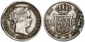1863. Isabel II. Sevilla. 1 real. (Cal. 443). 1,33 g. Defecto de acuñación en reverso. Parte de la gráfila de otra moneda. Muy curiosa. (MBC-).