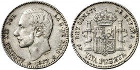 1882/1*1882. Alfonso XII. MSM. 1 peseta. (Cal. 57). 5,02 g. Buen ejemplar. Rara rectificación. MBC+.