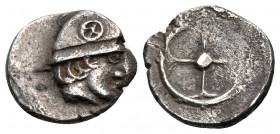 GAUL. Massalia. Circa 440-410 BC. Obol (Silver, 10 mm, 0.97 g). Male head to right, wearing helmet decorated with four-spoked wheel. Rev. Wheel with f...