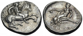 CALABRIA. Tarentum. Circa 344-340 BC. Nomos (Silver, 22 mm, 7.67 g, 3 h). Helmeted ephebe, nude, holding a small round shield and a lance with his lef...