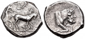 SICILY. Gela. Circa 450-440 BC. Tetradrachm (Silver, 26 mm, 17.42 g, 5 h). Quadriga driven slowly to right by a bearded charioteer; above, Nike flying...