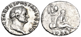 Vespasian, 69-79. Denarius (Silver, 17 mm, 3.21 g, 6 h), Judaea Capta issue, Rome, 69-70. IMP CAESAR VESPASIANVS AVG Laureate head of Vespasian to rig...