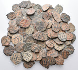 BYZANTINE. Circa 6th - 13th century. (Bronze, 443.00 g). An interesting lot of One Hundred (100) Byzantine bronze coins. Average grade fair to fine or...
