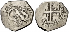 1698. Carlos II. Lima. 1/2 real. (Cal. 799). 1,61 g. Visible parte del nombre y ordinal del rey. Rara. MBC-.