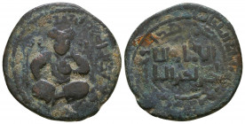 Artuqids of Mardin. Husam Ad-Din Yuluq-Arslan. Æ Dirhem. 580-597 AH = AD 1184-1201. Perseus seated with sword behind his head and holding the head od ...