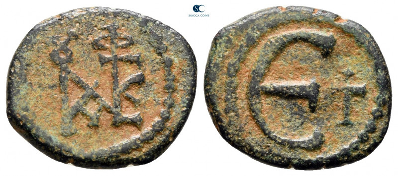 Justin II AD 565-578. Constantinople
Pentanummium Æ

13 mm, 1,71 g



ver...