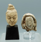A pair of fine Han Dynasty tomb figure heads from China, ca. 206 BC - 220 A.D . The first is 2? high and depicts an individual with a highly expressiv...