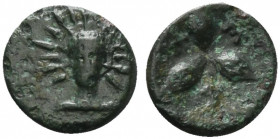 Southern Lucania, Metapontion, c. 300-250 BC. Æ (13mm, 1.74g). Facing head of Helios. R/ Three barley grains conjoined at base; race torch in one segm...