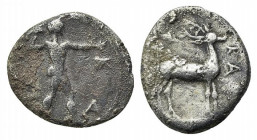 Bruttium, Kaulonia, c. 425-420 BC. AR Diobol (12.5mm, 1.11g, 12h). Nude Apollo walking r., holding branch in raised r. arm. R/ Stag standing r.; ivy l...