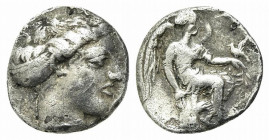 Bruttium, Terina, c. 420-400 BC. AR Triobol (11mm, 1.19g, 9h). Head of nymph r., hair bound in sphendone. R/ Nike seated r. on cippus, holding bird. H...