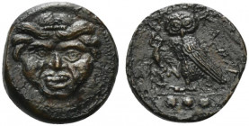 Sicily, Kamarina, c. 420-410 BC. Æ Tetras (14mm, 2.85g, 11h). Gorgoneion. R/ Owl standing l., head facing, holding lizard in talon. CNS III, 21; SNG A...
