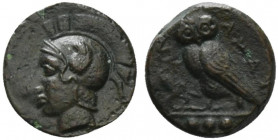 Sicily, Kamarina, c. 410-405 BC. Æ Tetras (14.5mm, 3.00g, 8h). Head of Athena l., wearing crested Corinthian helmet. R/ Owl standing l., grasping liza...