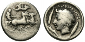 Sicily, Katane, c. 412-410 BC. AR Drachm (17mm, 4.25g, 1h). Unsigned dies in the style of Euainetos. Charioteer driving fast quadriga r.; above, Nike ...