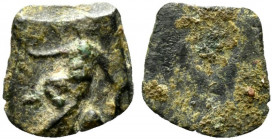 Roman Æ Tessera, c. 1st-3rd centuries AD (10mm, 0.45g). Child seated facing R/ Blank. Near VF