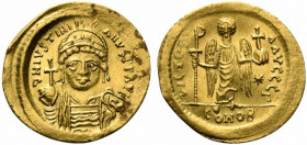 Justinian I (527-565). AV Solidus (21.5mm, 4.46g, 6h). Constantinople, 545-565. Helmeted and cuirassed bust facing, holding globus cruciger and shield...