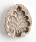 Islamic glazed mold for a palmette; ca. 5th - 7th centuries AD; height cm 8, wide cm 1