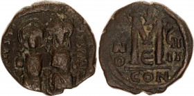 Byzantium Follis 565 - 574, AD. Justin II
Copper 14.14 g., 29 mm.; Obv: DNIVSTINVSPPAVG - Justin and Sophia on throne holding cruciform scepter . Rev...