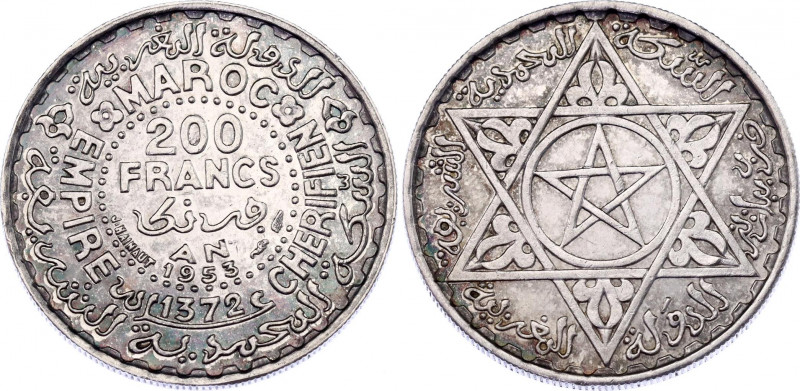 Morocco 200 Francs 1953 AH 1372
Y# 53; Silver; Mohammed V; AUNC with minor hair...