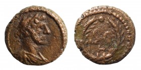 Trajan, 98-117. Half Quadrans (bronze, 1.05 g, 10 mm). Rome, for use in Syria, 116. Laureate and draped bust of Trajan to right, seen from behind. Rev...