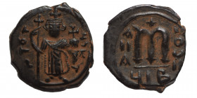 ARAB-BYZANTINE. Early Caliphate, 636-660. Fals (bronze, 3.81 g, 21 mm). Imitative series. Uncertain mint. Imperial Byzantine figure (Constans II) stan...