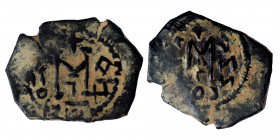 ARAB-BYZANTINE, Umayyad Caliphate, ca. 650 – 674. Fals (bronze, 4.76 g, 26 mm) Uncertain mint. Large M, blundered legend around. Rev. Large M, blunder...