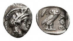 ATTICA. Athens. Obol (Circa 454-404 BC).
Obv: Helmeted head of Athena right.
Rev: AΘE.
Owl standing right, head facing; olive sprig and crescent to...