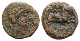 Spain, Kueliokos, c. 125-100 BC. Æ Unit (23mm, 10.18g, 2h). Bare male head r.; dolphin behind, dolphin and Θ before. R/ Horseman riding r., holding da...