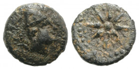 Spain, Malaka, 2nd century BC. Æ Quarter Unit (12mm, 1.69g). Head of Vulcan r., wearing cap. R/ Eight-rayed star with intercalations; central pellet. ...