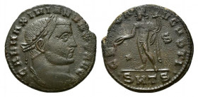 Galerius (305-311). Æ Follis (24mm, 6.37g, 12h). Thessalonica, c. 308-310. Laureate head r. R/ Genius standing l., holding patera and cornucopia; star...