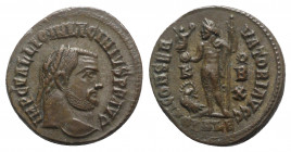 Licinius I (308-324). Æ Follis (19mm, 3.64g, 6h). Alexandria, 316-7. Laureate head r. R/ Jupiter standing facing, head l., holding Victory on globe an...