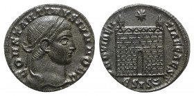 Constantine II (Caesar, 317-337). Æ Follis (18mm, 2.48g, 12h). Siscia, 328-9. Laureate head r. R/ Camp gate; ESIS-two crescents. RIC VII 216. Dark pat...