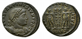 Constantine II (Caesar, 316-337). Æ Follis (16mm, 2.51g, 5h). Antioch, 330-5. Laureate and cuirassed bust r. R/ Two signa between two soldiers, each h...