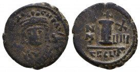 Maurice Tiberius. 582-602. AE 
Reference:
Condition: Very Fine

Weight: 2.9 gr
Diameter: 17 mm