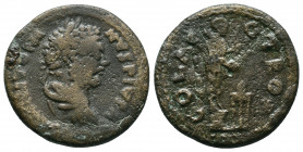 Troas, Alexandria Troas. Caracalla. 198-217 AD. AE 9,17gr. Laureate, draped and cuirassed bust right / Apollo standing right sacrificing over tripod. ...